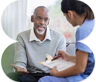 Community nurse providing in-home care to elderly man
