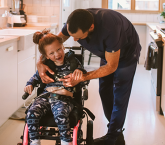 Support worker assisting with high intensity daily personal activities for NDIS participant