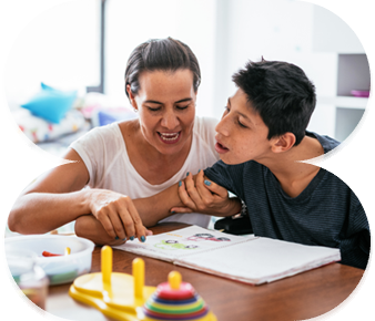 Support worker guiding NDIS participant in developing daily living and life skills