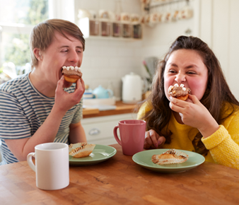 NDIS participants taking part in shared daily activities within a group home setting