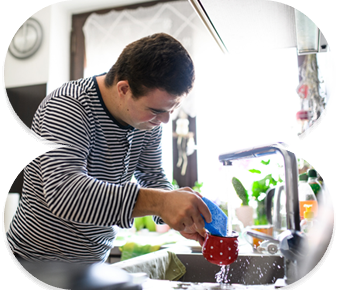 Support worker assisting with household tasks for an NDIS client